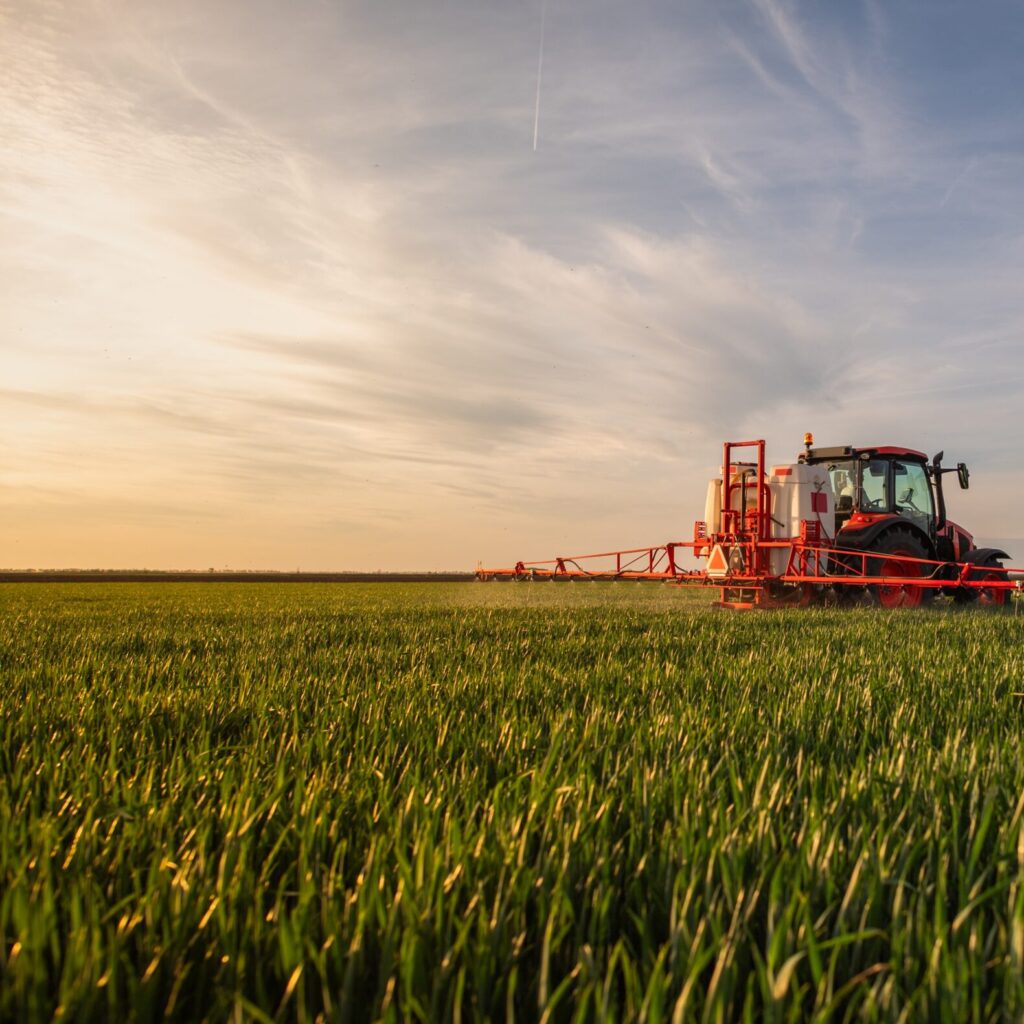 Tractor spraying in field
